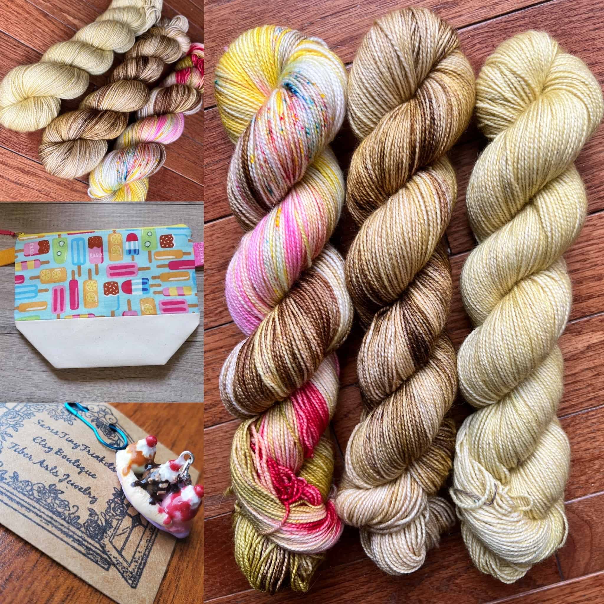 Three skeins of yarn in banana split colors with a popsicle project bag and a banana split charm.