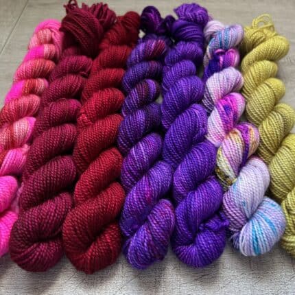 A set of magic carpet themed minis in red, purple and gold hues.