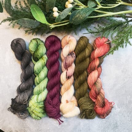 A set of 6 mini skeins in rich greens, browns and plums.
