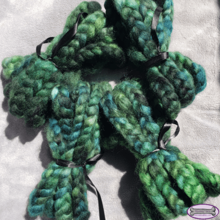 Four braids of green wool, each tied into a bundle.