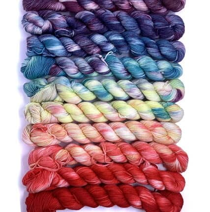 A set of rainbow variegated yarn.