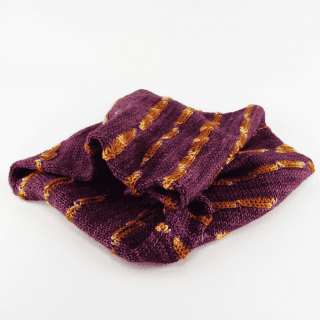 A maroon and orange knit cowl.