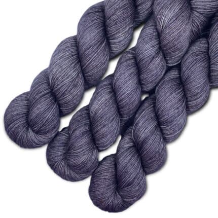 Three skeins of light purple yarn.