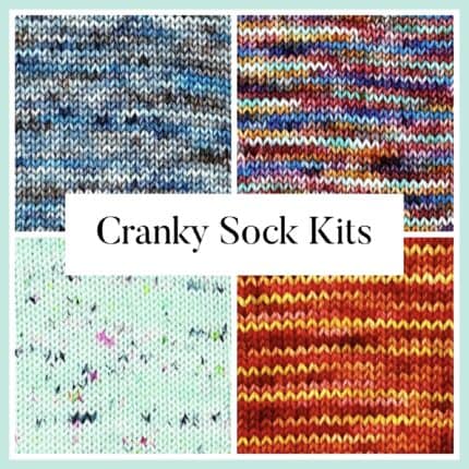 A square divided into four quadrants, each with a different colorway of yarn knitted up: blue with speckles, multi colored, red and yellow, and light turquoise with colorful speckles. The square has the words "Cranky Socks" in the middle.