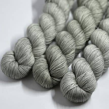 Three skeins of gray yarn.