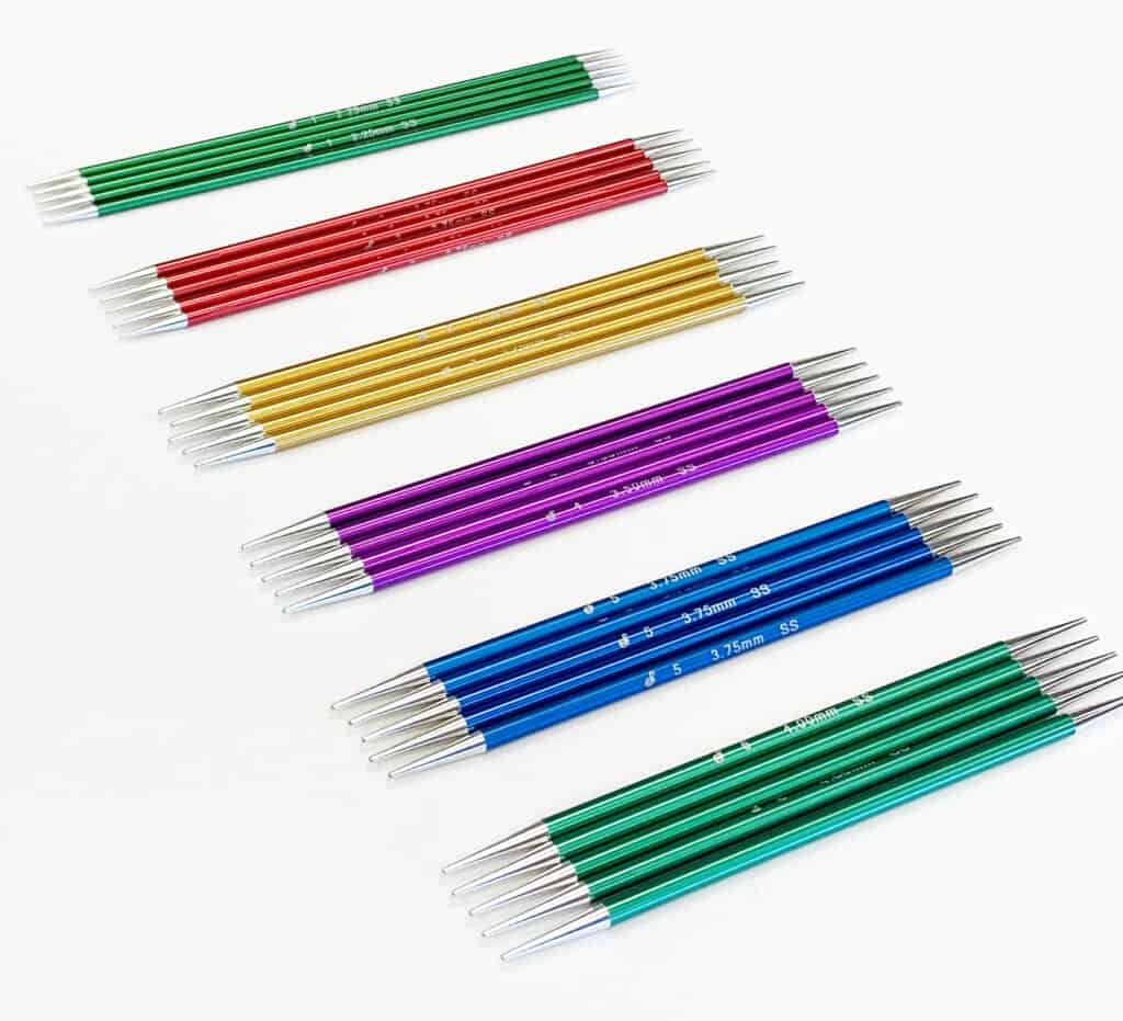 A rainbow of metal double pointed knitting needles.