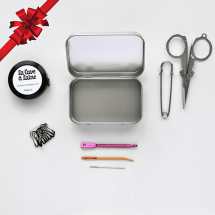 A kit of needles, stitch markers, and other tools