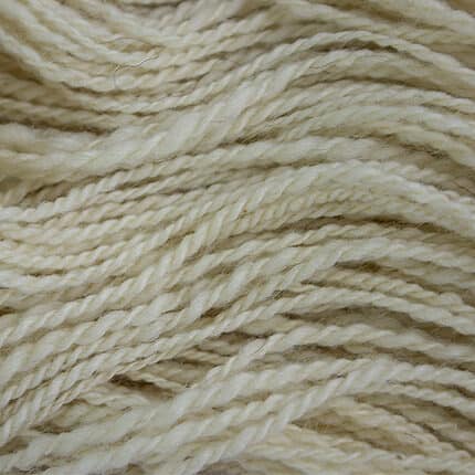 A closeup of cream yarn.