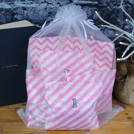 Pink and white striped numbered bags.