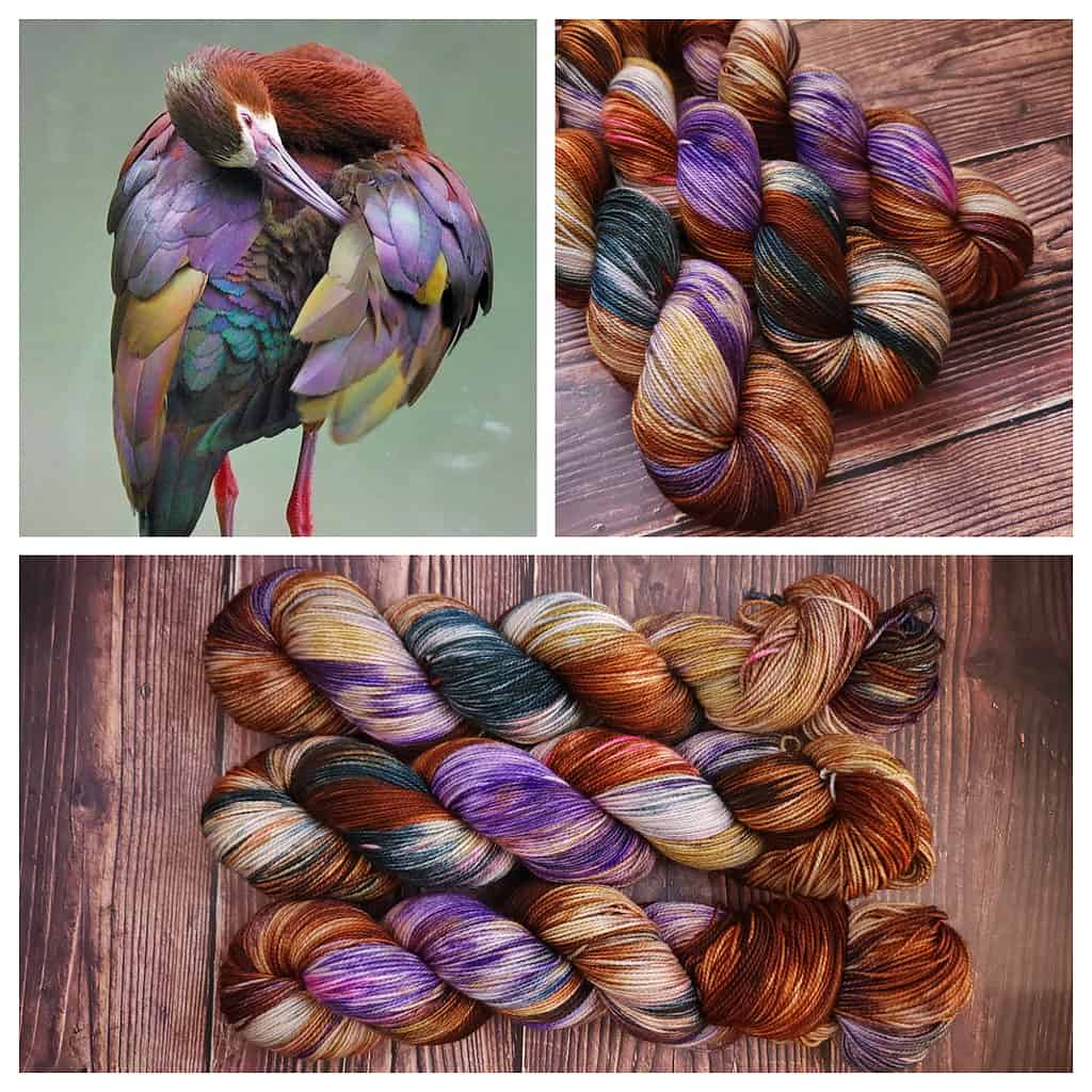 A bird with purple, crimson, teal and gold feathers and yarn in the same color.