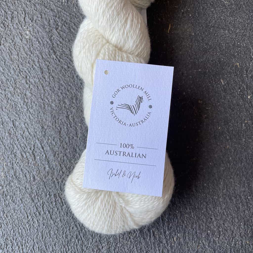 Cream colored yarn with a tag for Great Ocean Road Woolen Mill.