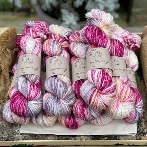 Variegated pink, cream and purple chunky yarn.