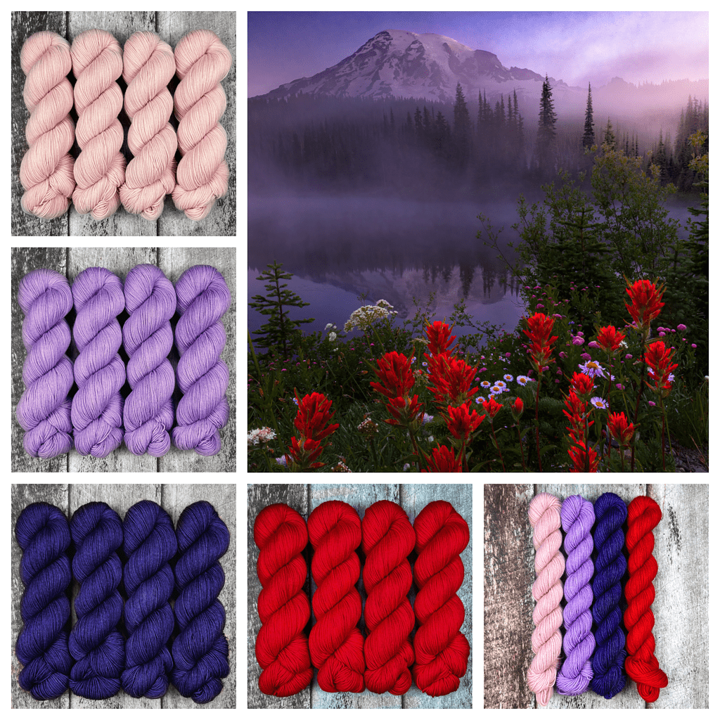 Red and purple wildflowers at the base of a mountain, with skeins of pale pink, lilac, deep blue and red yarn.