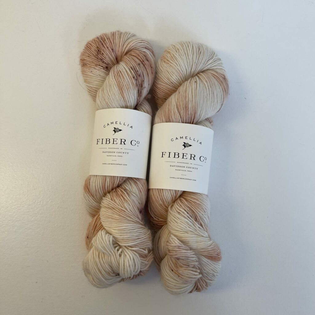 2 skeins of peachy yarn.