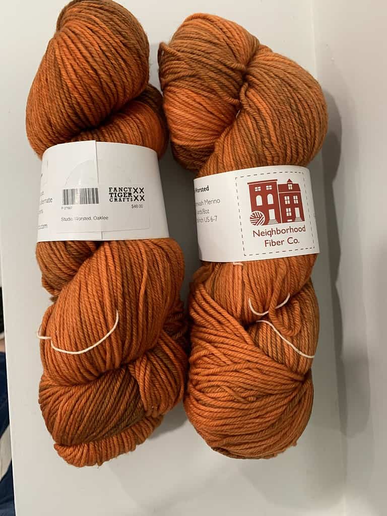Skeins of orange tonal yarn.