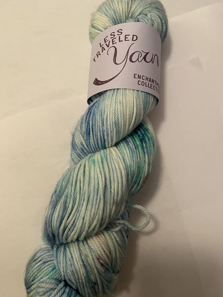 A skein of blue speckled yarn.