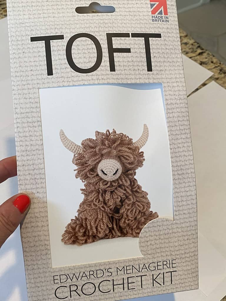 Crochet Kit to make Highland cow in brown and cream colors.