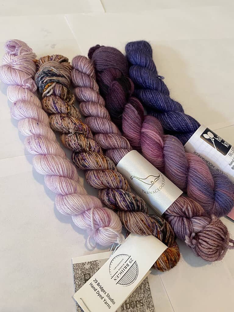 5 skein mini set of purple yarns.
