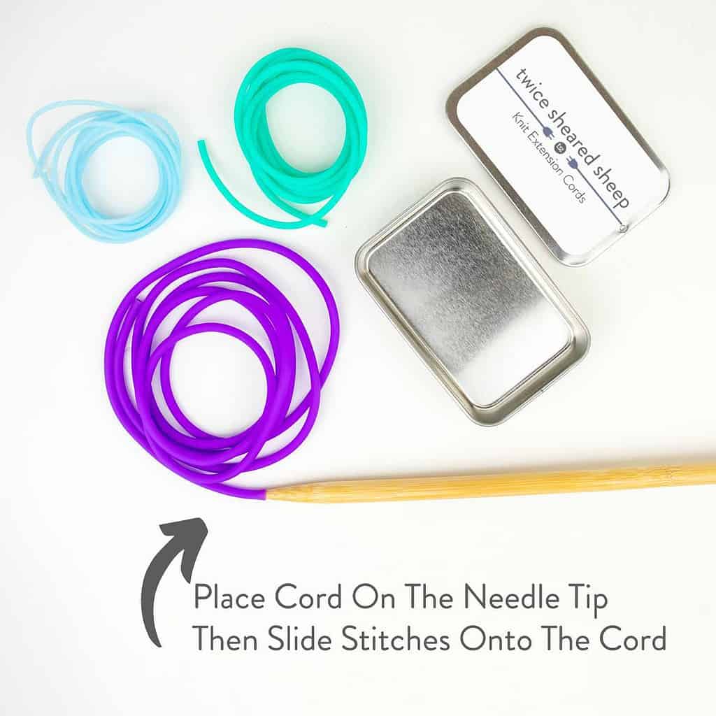 Purple, blue, and green knit extension cords with a silver tin. The purple cord is attached to the tip of the wooden needle and an arrow points to it from text reading Place cord on the needle tip then slide stitches onto the cord.