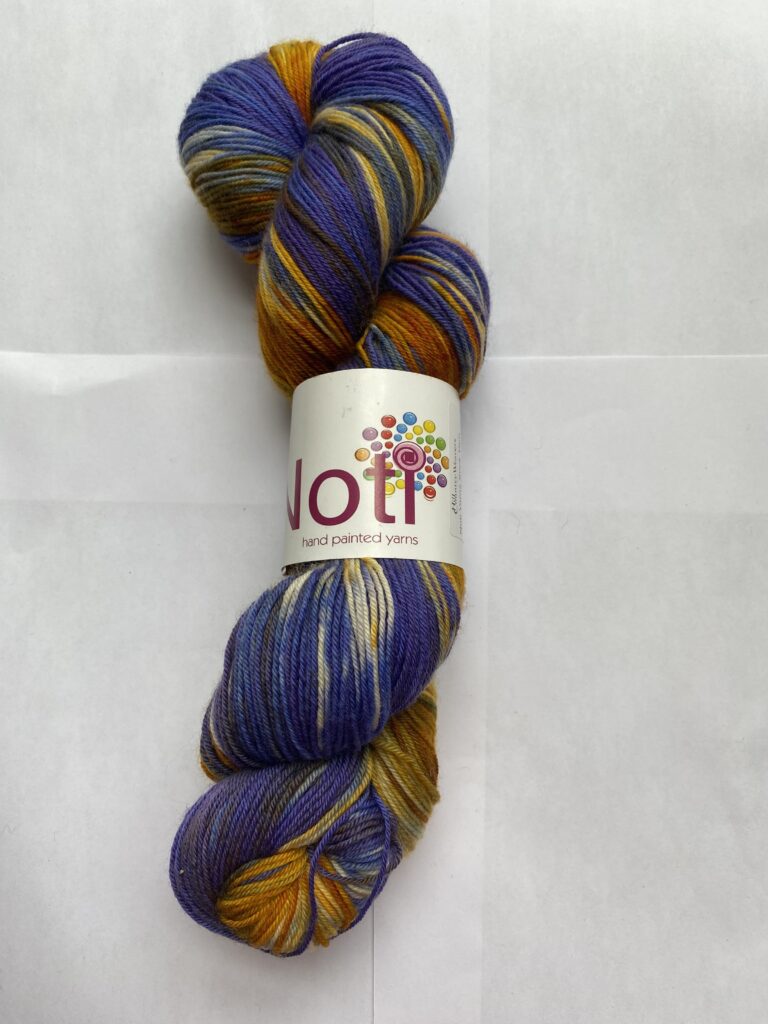 One skein of yarn and purple and rust.