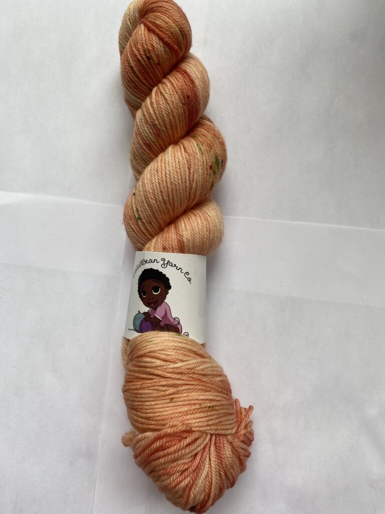 One skein of speckled peach yarn.