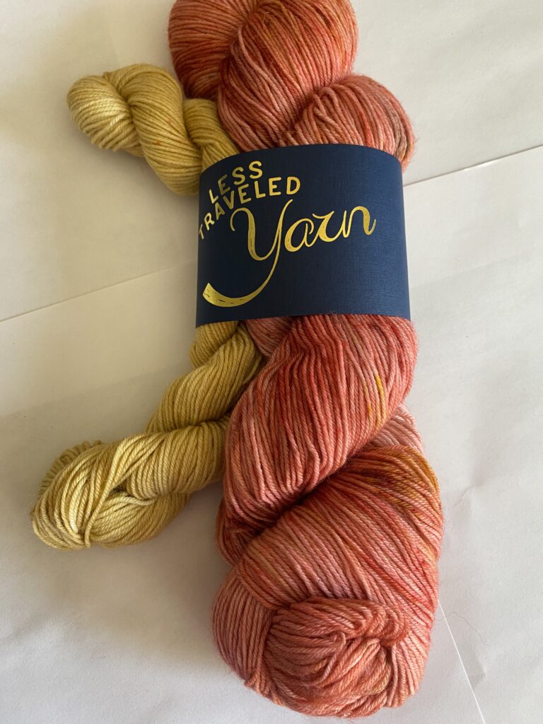 One full skein orange yarn, and one mini skein yellow yarn.