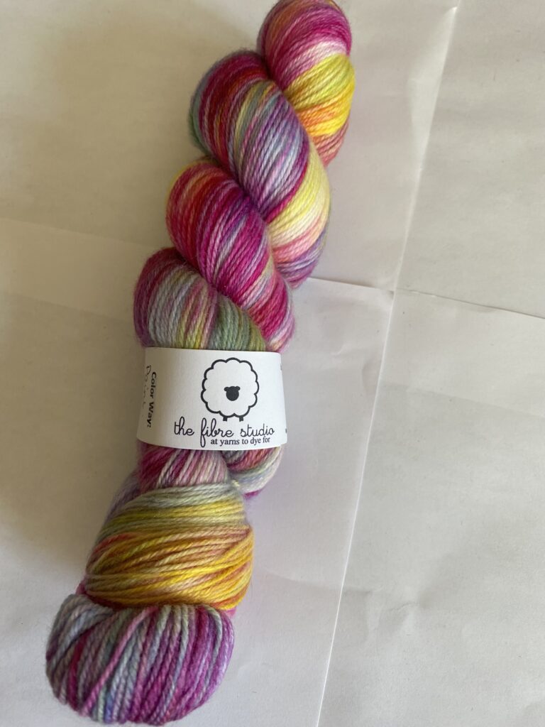One skein, variegated, purple, pink, yellow, blue, green yarn.