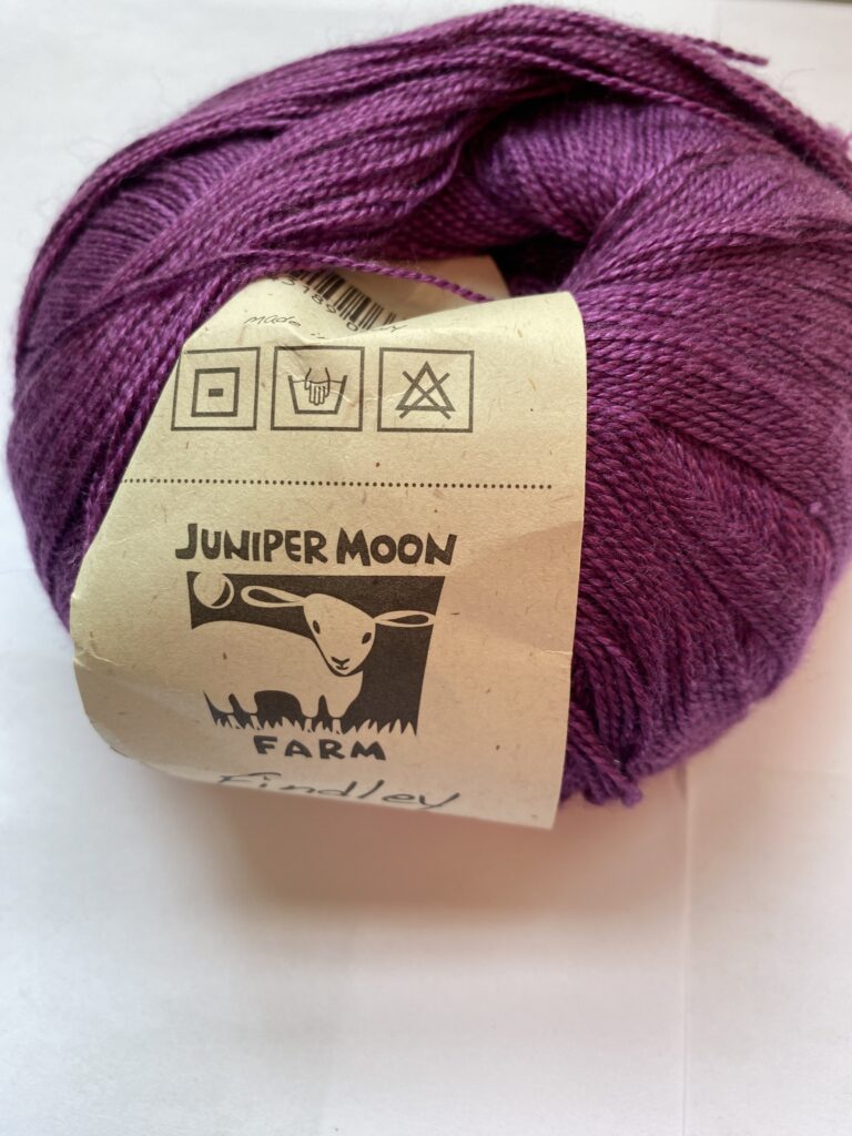 One ball of purple yarn.