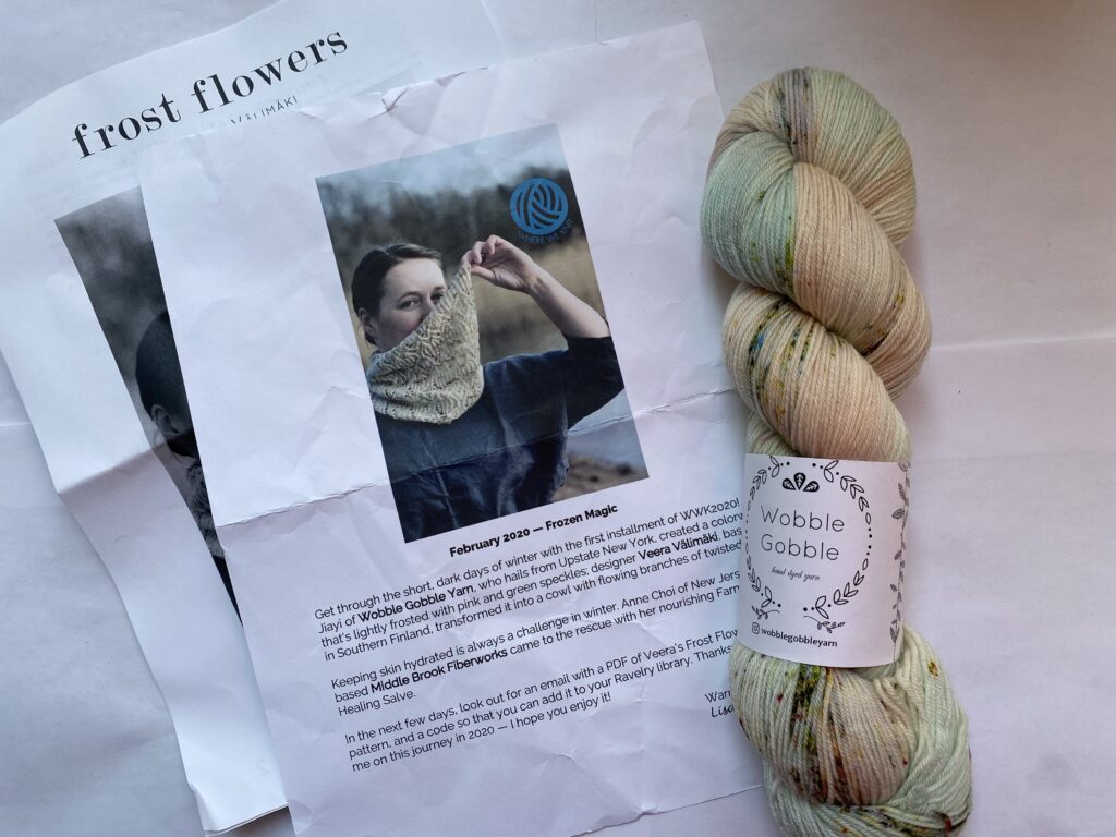 One skein green, light peach and gray yarn with cowl pattern.