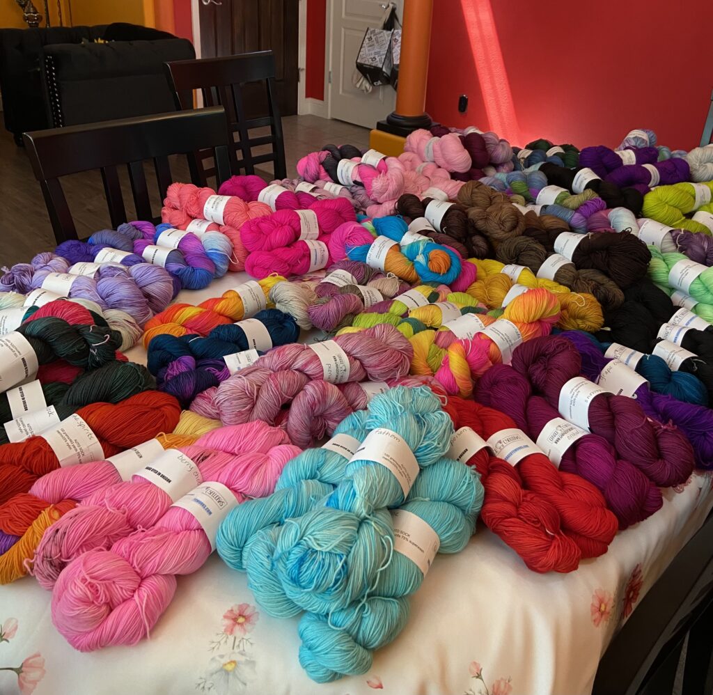 A table with sock yarn skeins.
