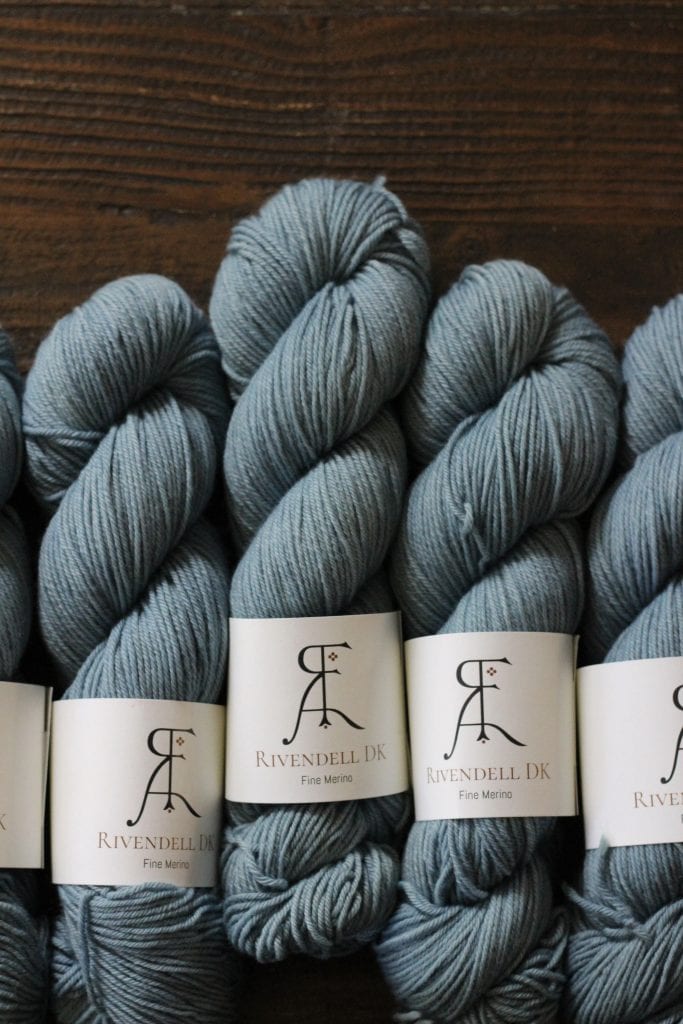 Skeins of light blue DK yarn.
