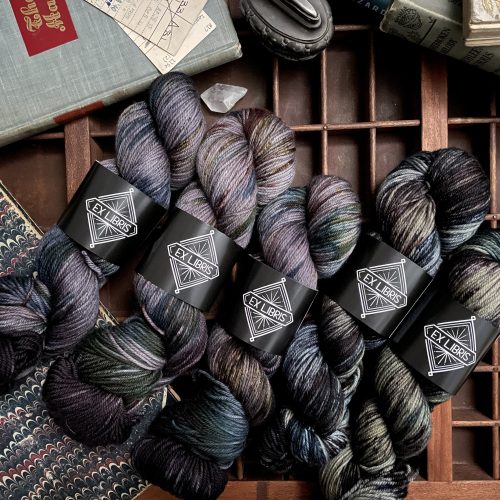 Gray moody skeins of yarn inspired by books