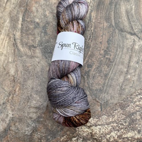 A skein of purple and brown yarn.