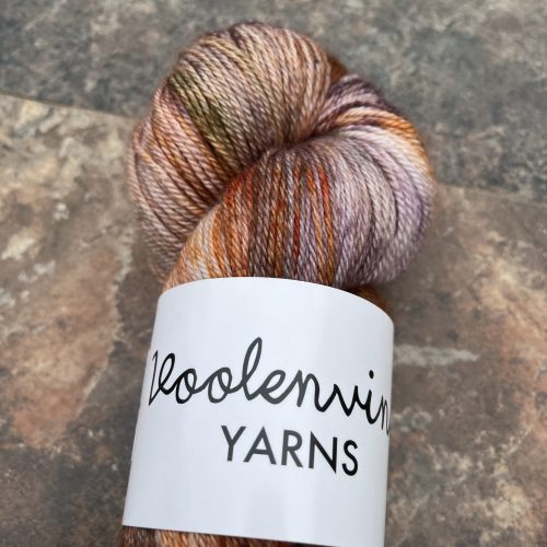 A skein of brown and purple yarn.