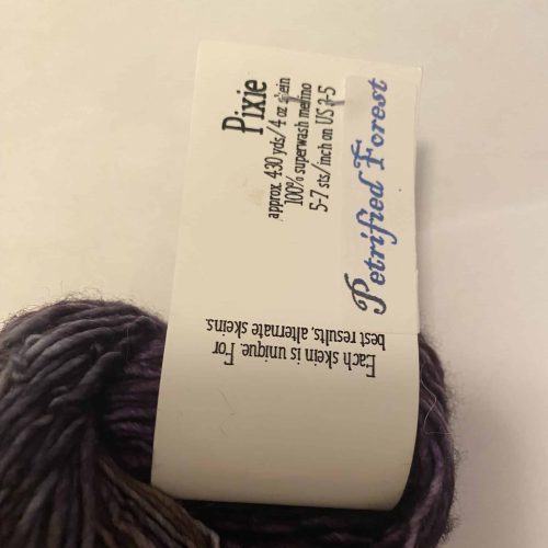 A skein of variegated purple yarn from Dragonfly Fibers.