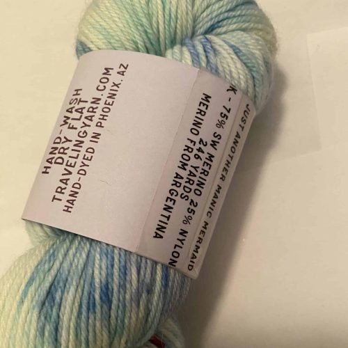 A skein of blue speckled yarn.