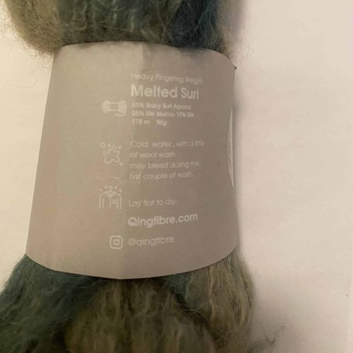The label on a skein of fuzzy green yarn.