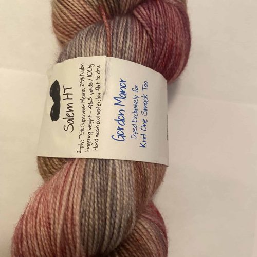 A skein of pink and gray variegated sock yarn.