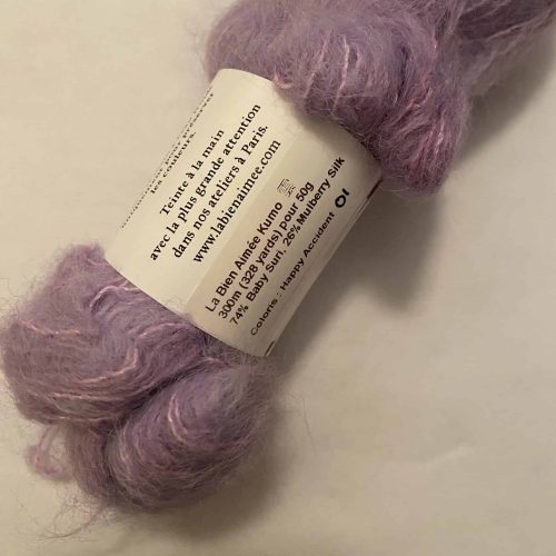 A skein of fuzzy light purple yarn.
