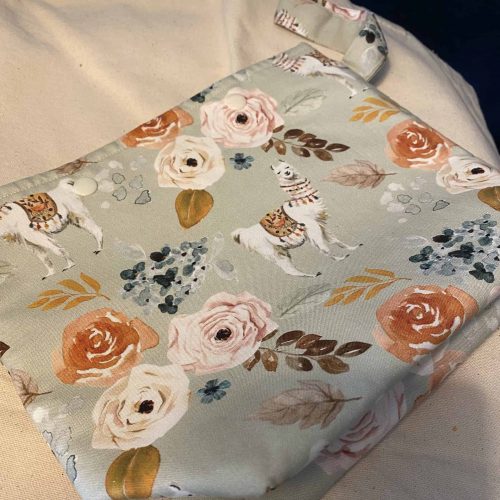 Project bag with llama and flower motif.
