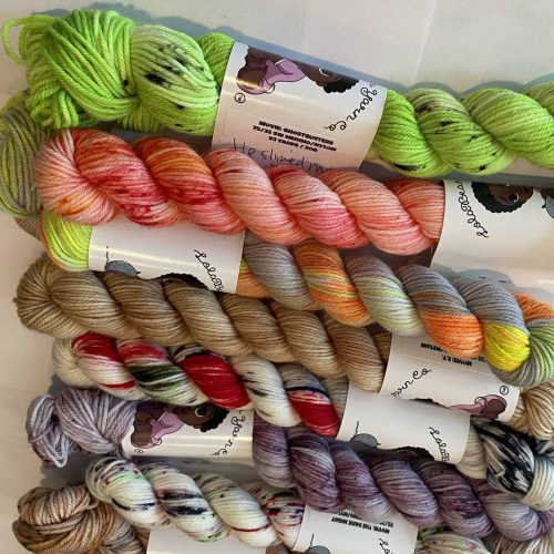 Mini skeins of bright colored yarn.