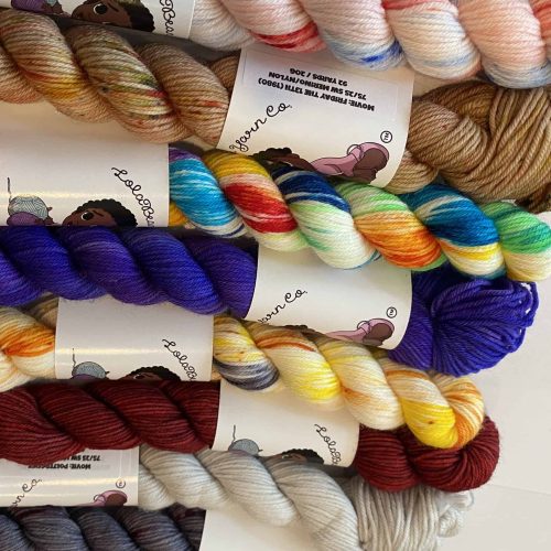 Mini skeins of bright colored yarn.