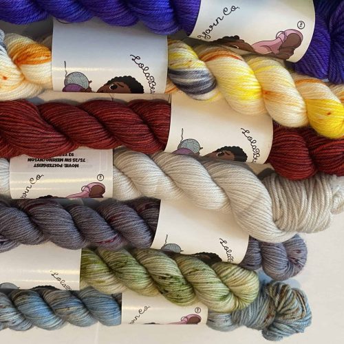 Mini skeins of bright colored yarn.