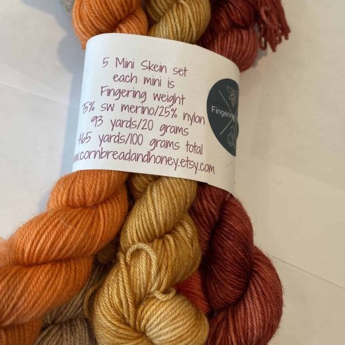 5 mini skein bundle of fall color yarn in yellow, orange and brown.