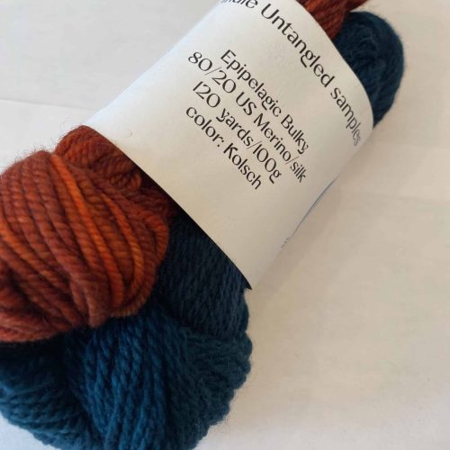 3 skein set of green, red and yellow yarn.