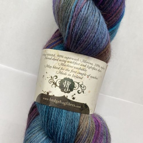 One skein of variegated blue, purple and green yarn.