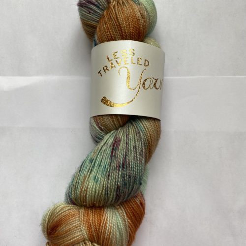 One skein of variegated green, peach and aqua sparkle yarn.