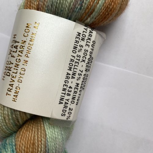 One skein of variegated green, peach and aqua sparkle yarn.
