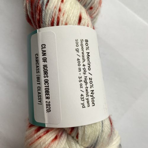 One skein of red, white and gray yarn.