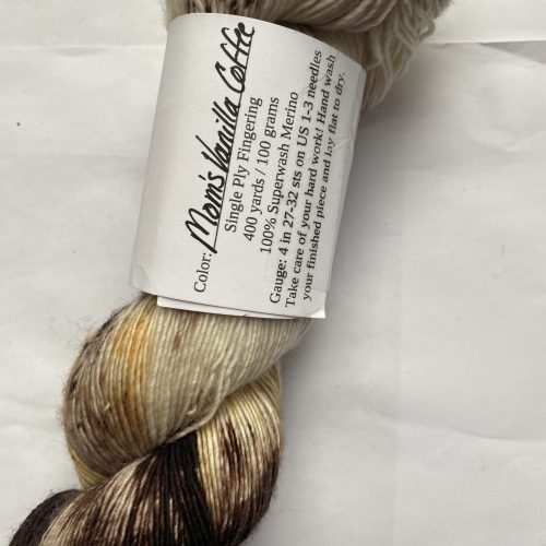 One skein of brown, peach, cream yarn.